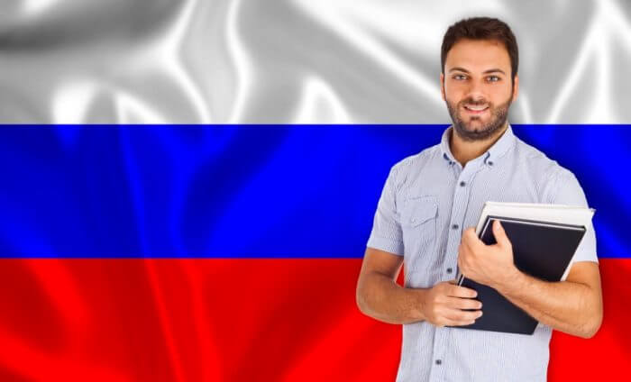 Male student of languages Russian flag