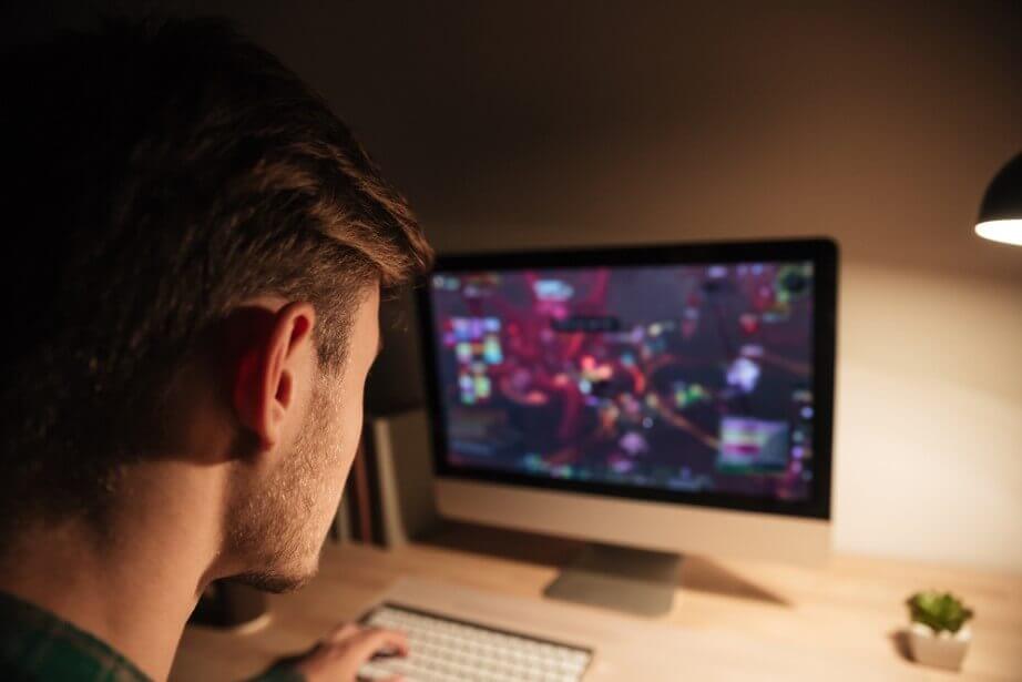 young man playing computer games